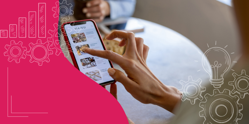 Smart Phone exibindo um cardápio digital interativo com imagens de pratos variados em uma mesa de restaurante, representando a modernização do serviço.