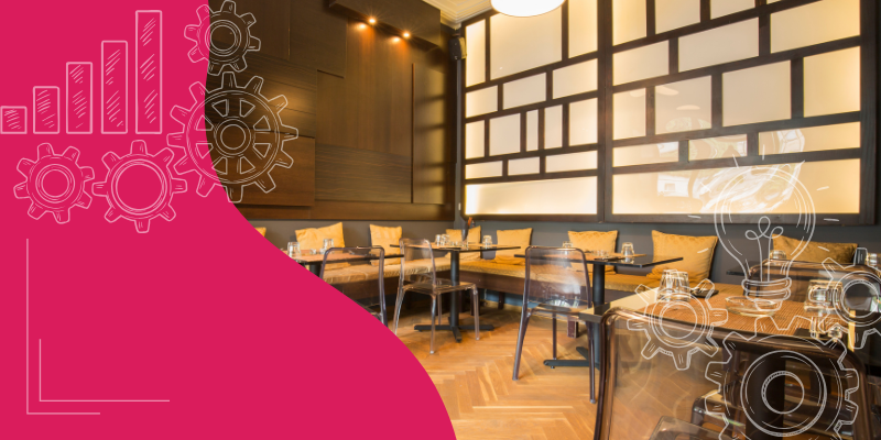 Interior de restaurante moderno com mesas elegantes, cozinha ao fundo e chefs em uniformes brancos cozinhando.